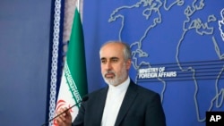 FILE - In this photo released on Aug. 11, 2022, by the Iranian Foreign Ministry, Foreign Ministry spokesperson Nasser Kanaani speaks in Tehran, Iran. Kanaani said Monday that a North Korean delegation visited Iran, but dismissed speculation about cooperation on a missile program.
