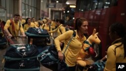 FILE - Australia's Olympic athletes arrive at the Tom Jobim International Airport in Rio de Janeiro, Brazil, July 26, 2016. 