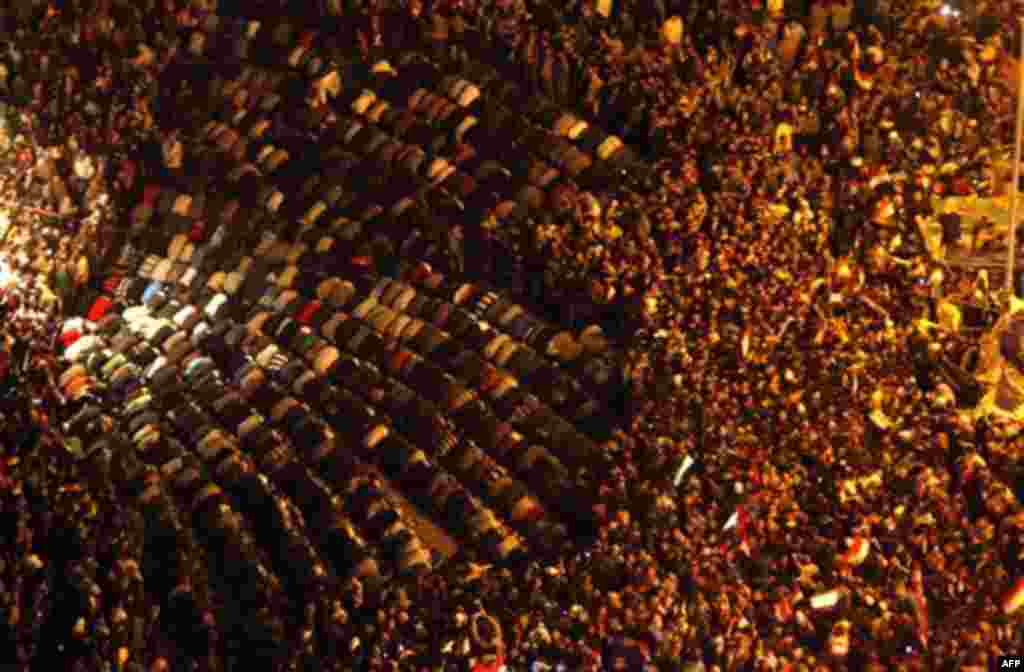 Egyptians celebrate after President Hosni Mubarak resigned and handed power to the military at Tahrir square, in Cairo, Egypt, Friday, Feb. 11, 2011. Egypt exploded with joy, tears, and relief after pro-democracy protesters brought down President Hosni Mu