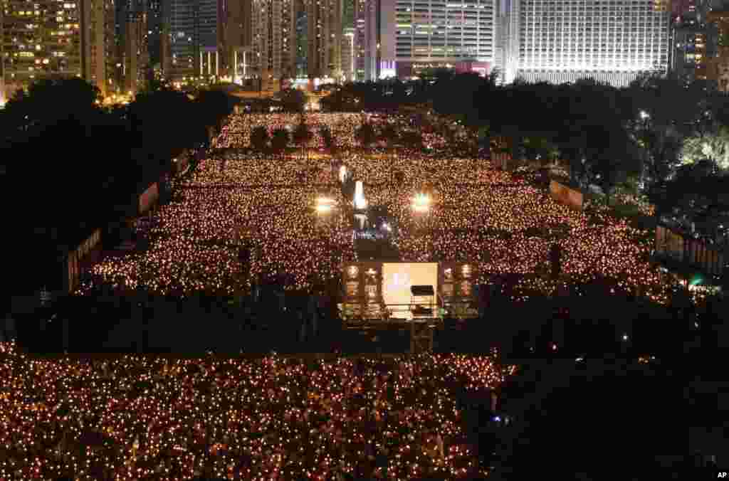 Tens of thousands of people attend a candlelight vigil at Hong Kong's Victoria Park Monday, June 4, 2012 to mark the 23rd anniversary of the Chinese military crackdown on the pro-democracy movement in Beijing.