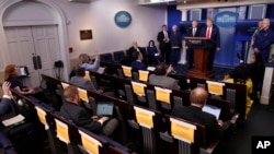 Reporters ask questions of President Donald Trump as he speaks about the coronavirus in the James Brady Press Briefing Room of the White House in Washington, April 17, 2020.