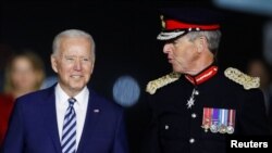 U.S. President Joe Biden is welcomed as he arrives at Cornwall Airport Newquay, near Newquay, Cornwall, Britain June 9, 2021. 