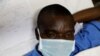 A mock coronavirus patient waits to be transported during an exercise simulating the treatment of a large number of coronavirus patients at the Aga Khan University Hospital in Nairobi, Kenya, April 9, 2020. 