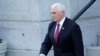 Vice President Mike Pence walks to the West Wing of the White House after addressing staff on the steps of the Eisenhower Executive Office Building, in the White House complex, Jan. 19, 2021.