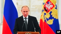 FILE - Russian President Vladimir Putin speaks at a meeting with senior officers in the Kremlin in Moscow.