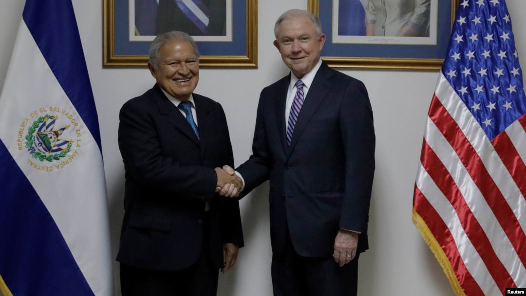 El Salvador's President Salvador Sanchez Ceren (L), shakes hands with U.S. Attorney General Jeff Sessions (R) during a visit in San Salvador, El Salvador, July 27, 2017. 