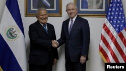 El Salvador's President Salvador Sanchez Ceren (L), shakes hands with U.S. Attorney General Jeff Sessions (R) during a visit in San Salvador, El Salvador, July 27, 2017. 