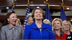 House Minority Leader Nancy Pelosi, accompanied by women House Democrats, announces during a news conference on Capitol Hill that she wants to remain as the top Democrat in the House of Representatives, Nov. 14, 2012. 