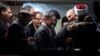 Babar Khan Ghori (R) of Pakistan's political party Muttahida Qaumi Movement (MQM) hugs cleric and leader of Minhaj-ul-Quran Muhammad Tahirul Qadri after they reached an agreement on fourth day of protests in Islamabad, January 17, 2013. 