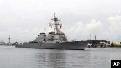 FILE - The guided missile destroyer USS Benfold arrives in port in Qingdao in eastern China's Shandong Province, Aug. 8, 2016. 