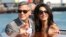 George Clooney, left, and Amal Alamuddin arrive in Venice, Italy, Sept. 26, 2014. 