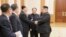 North Korean leader Kim Jong Un meets members of the high-level delegation of the Democratic People's Republic of Korea, which visited South Korea to attend the opening ceremony of the 23rd Winter Olympics.