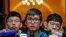 Pro-democracy activist Alex Chow, center, speaks to reporters outside the Court of Final Appeal in Hong Kong, Feb. 6, 2018. 