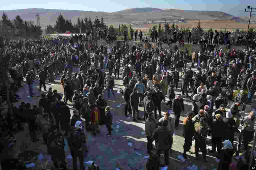 People stand outside the infamous Saydnaya military prison, just north of Damascus, Syria, Dec. 9, 2024.&nbsp;