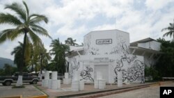 The entrance of the restaurant "La Leche" stands closed after armed men abducted as many as 16 people who were dining in the upscale restaurant in Puerto Vallarta, Mexico, Aug. 15, 2016. 