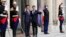 French President Emmanuel Macron, center right, and Japan's Prime Minister Shinzo Abe wave before their talks at the Elysee Palace, in Paris, April 23, 2019.