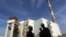 FILE - Iranian workers stand in front of the Bushehr nuclear power plant, about 1,200 kilometers south of Tehran.