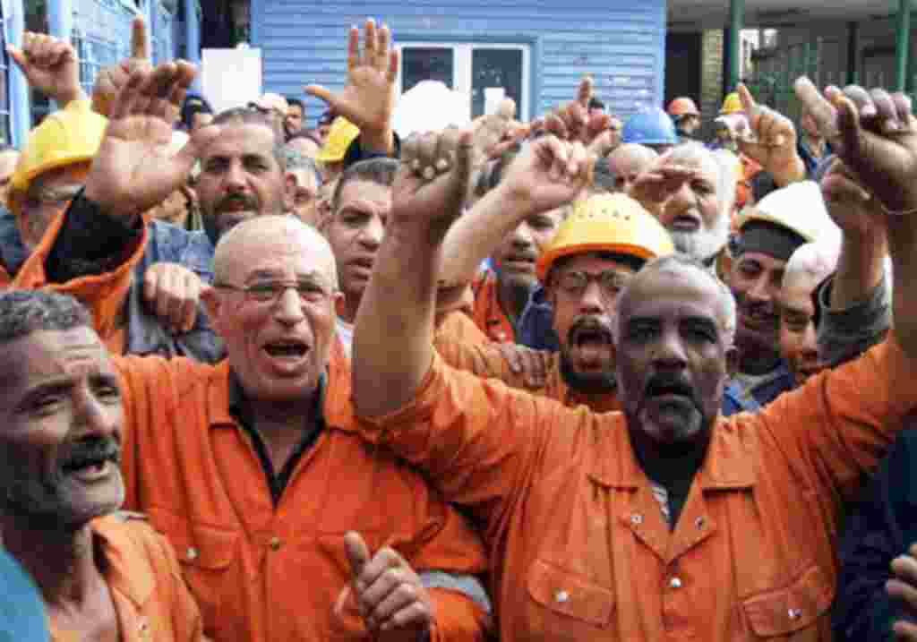 Suez Canal Company workers protest as they began an open-ended strike in front of the company's headquarters in Ismailia City, Egypt,Wednesday, Feb. 9, 2011.