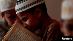 A student memorizes the Quran at a madrassa in Murree, Pakistan, Sept. 27, 2017