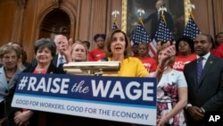 Speaker of the House Nancy Pelosi, D-Calif., joins fellow Democrats and activists seeking better pay as the House approved legislation to raise the federal minimum wage, at the Capitol in Washington, July 18, 2019.