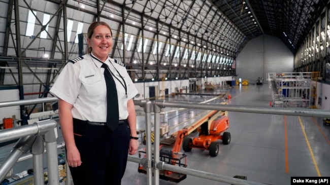 In this May 15, 2017 photo, Kristen Arambula, an airship pilot, poses for a picture in the Goodyear hangar in Akron, Ohio. (AP Photo/Dake Kang)