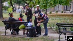 Migrants, mostly from Syria, headed for EU member Hungary, rest at the central bus station in Kanjiza, northern Serbia, near the Hungarian border, June 25, 2015.