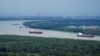 Mississippi river traffic moves in the aftermath of Hurricane Ida, Aug. 30, 2021, near Lafitte, La. 
