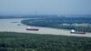Mississippi river traffic moves in the aftermath of Hurricane Ida, Aug. 30, 2021, near Lafitte, La. 