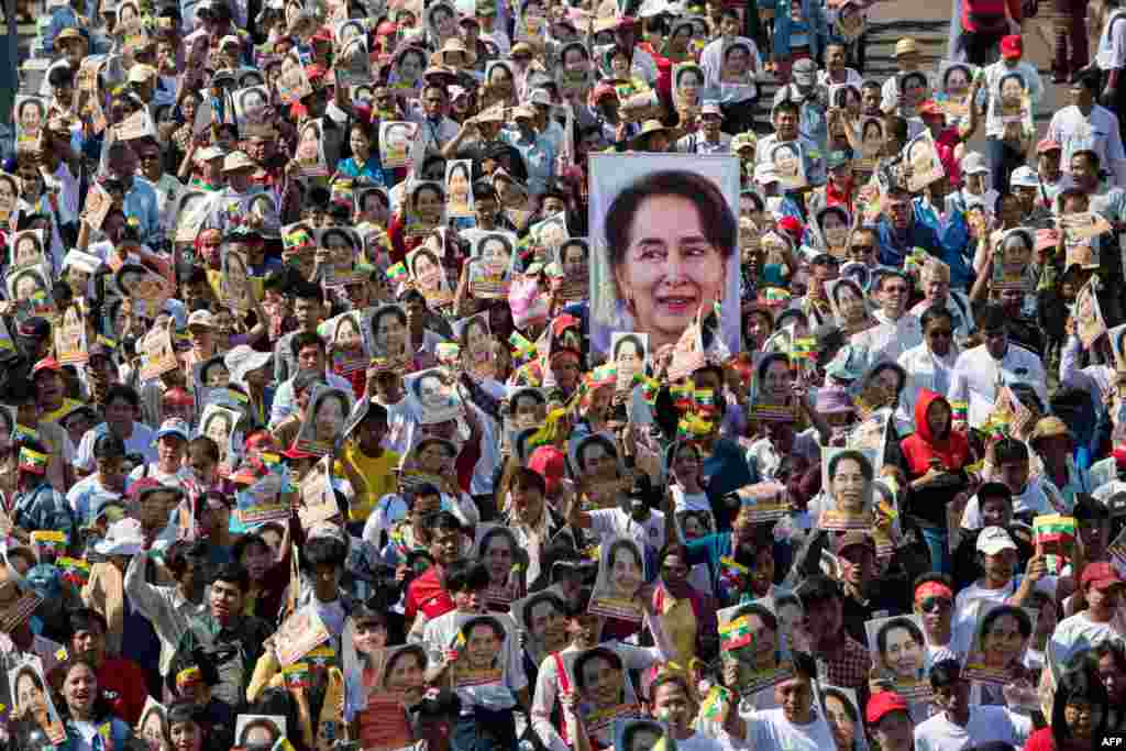 People participate in a rally in Yangon, in support of Myanmar&#39;s State Counsellor Aung San Suu Kyi, as she prepares to defend Myanmar at the International Court of Justice at The Hague against accusations of genocide against Rohingya Muslims.