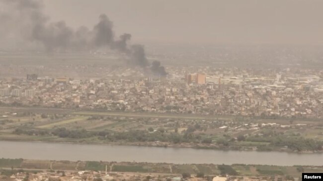 A drone view shows smoke rising over the Khartoum North Light Industrial Area, in Bahri, Sudan, April 23, 2023, in this still image taken from video obtained by Reuters. (Video obtained by Reuters/ via REUTERS)