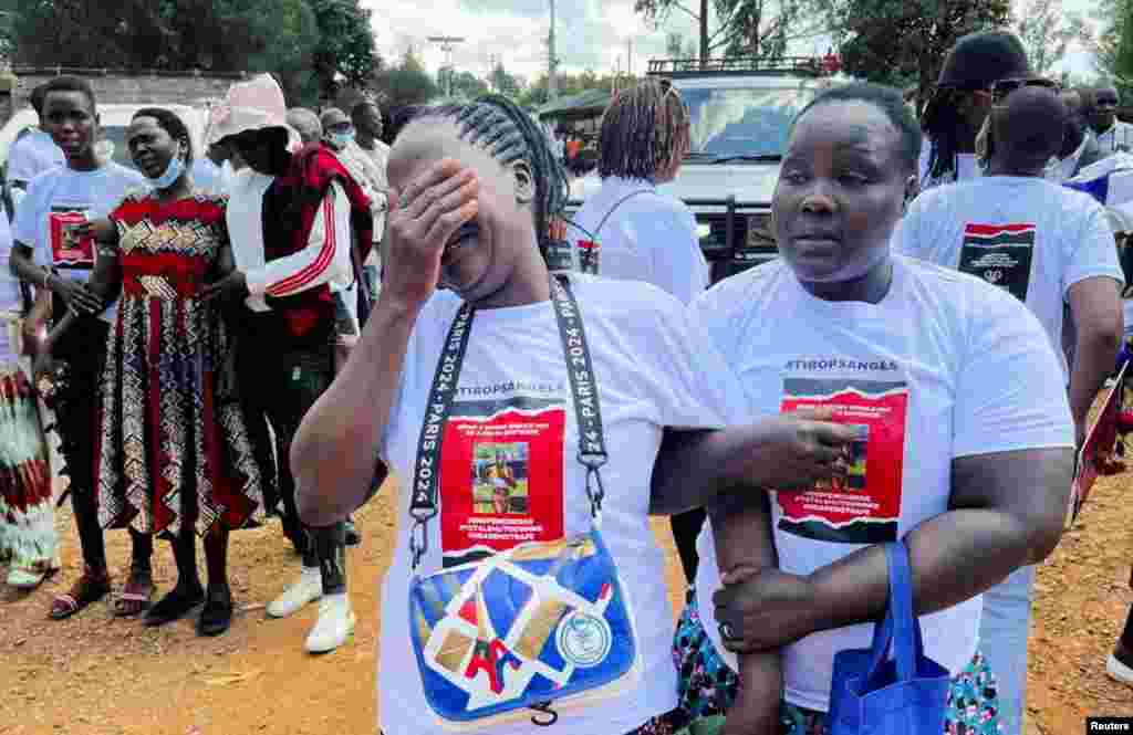 Agnes Cheptegei is assisted as she mourns her daughter and Olympian Rebecca Cheptegei, who died after her former boyfriend doused her in petrol and set her ablaze, at the Moi Teaching & Referral Hospital (MTRH) funeral home, in Eldoret, Kenya.