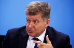 FILE - International Labor Organization Director-General Guy Ryder attends a news conference after a meeting at the Chancellery in Berlin, Oct. 1, 2019.