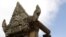 A Cambodian flag flutters near an entrance gate to Cambodia's Preah Vihear temple on the Cambodian-Thai- border in Preah Vihear province.