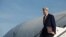 FILE - U.S. Secretary of State John Kerry gets off his plane upon his arrival at Rome's Ciampino airport, Feb. 1, 2016. 