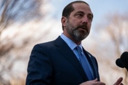 Secretary of Health and Human Services Alex Azar talks with reporters about the coronavirus, at the White House, Feb. 28, 2020, in Washington.