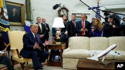 President Donald Trump speaks during a meeting with Italian President Sergio Mattarella in the Oval Office of the White House, Oct. 16, 2019, in Washington.