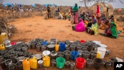 People wait for food and water in the Warder district in the Somali region of Ethiopia, Jan. 28, 2017. Ethiopia is struggling to counter a new drought in its east that authorities say has left 5.6 million people in need.