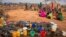 People wait for food and water in the Warder district in the Somali region of Ethiopia, Jan. 28, 2017. Ethiopia is struggling to counter a new drought in its east that authorities say has left 5.6 million people in need.