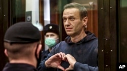 FILE - Russian opposition leader Alexei Navalny is shown in this handout photo taken from video provided by the Moscow City Court on Feb. 2, 2021. President Vladimir Putin says he supported the idea of releasing Navalny in a prisoner exchange just days before Navalny's death.