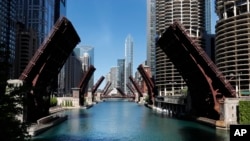 Several street bridges over the Chicago River remain closed early Sunday morning, May 31, 2020 in Chicago, after a night of unrest and protests over the death of George Floyd.
