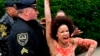 Topless Protester Gets Close to Bill Cosby as Retrial Begins