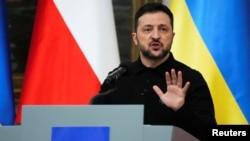 Ukraine's President Volodymyr Zelenskyy speaks at a press conference in Warsaw, Poland, Jan. 15, 2025. 