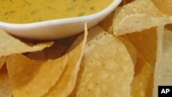 FILE - Nacho and creamy cheese dip.