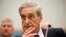 FBI Director Robert Mueller listens as he testifies on Capitol Hill in Washington, June 13, 2013.