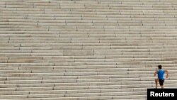 A runner ascends the steps leading up to the west side of the Lincoln Memorial in Washington, D.C., Oct. 18, 2012. The steps are a popular spot for fitness enthusiasts. 