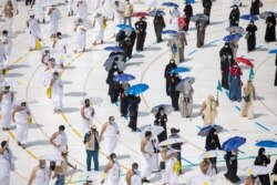 Muslim pilgrims maintain social distancing as they circle the Kaaba at the Grand mosque during the annual Hajj pilgrimage, in the holy city of Mecca, Saudi Arabia, July 29, 2020. (Saudi Ministry of Media/via Reuters).