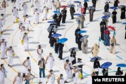 Muslim pilgrims maintain social distancing as they circle the Kaaba at the Grand mosque during the annual Hajj pilgrimage, in the holy city of Mecca, Saudi Arabia, July 29, 2020. (Saudi Ministry of Media/via Reuters).