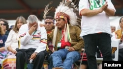 Indigenous people are seen during Pope Francis' visit to Maskwacis, Alberta, July 25, 2022. 