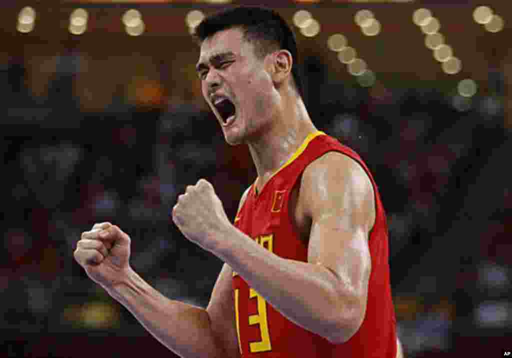 China's Yao Ming celebrates after scoring a basket against Angola during a men's Group B basketball game at the Beijing 2008 Olympic Games, August 14, 2008 (Reuters).