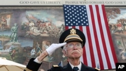 FILE - U.S. Army veteran 2nd Lt. Allen Brandstater salutes during a Veterans Day observance in Los Angeles on Nov. 11, 2022. (AP Photo/Damian Dovarganes)